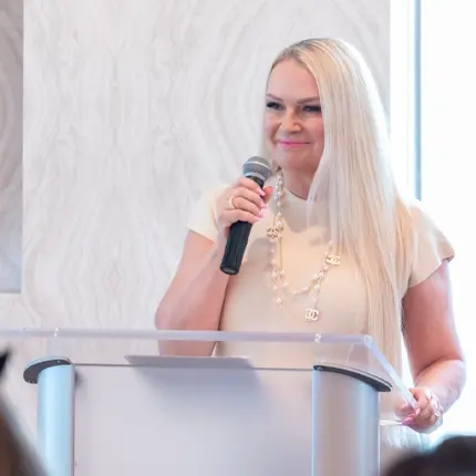 Woman with microphone giving a speech